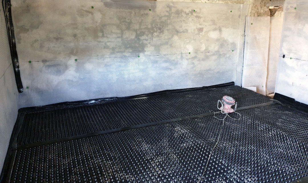 Basement waterproofing system installation